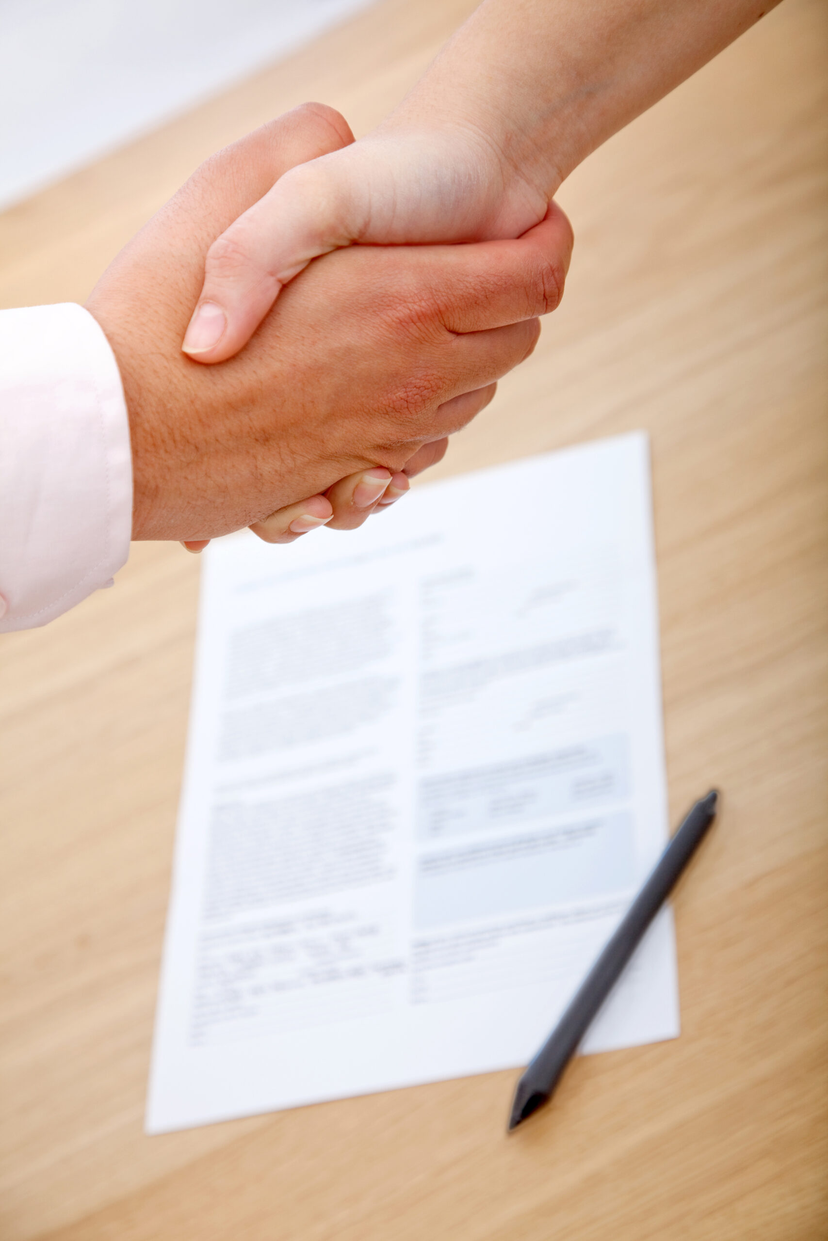 business-agreement-handshake-with-document-on-tabl-2026-03-26-01-59-20-utc
